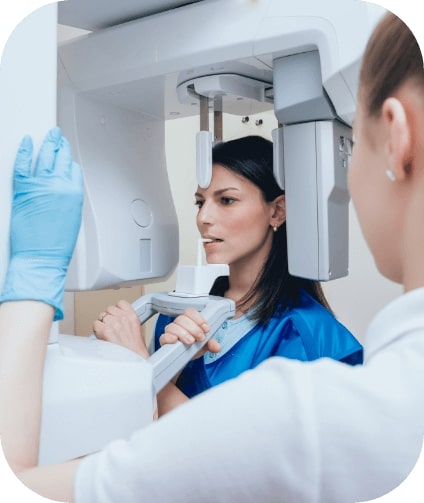Woman receiving 3 D C T cone beam digital x ray scanner